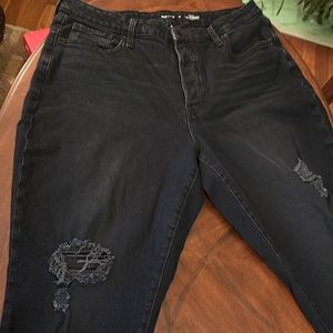 Worn once and washed once. Basically new distressed black jeans. Button fly.